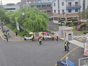 비 속에서도 안전 지킴이…광양여고, 민관학 합동 캠페인